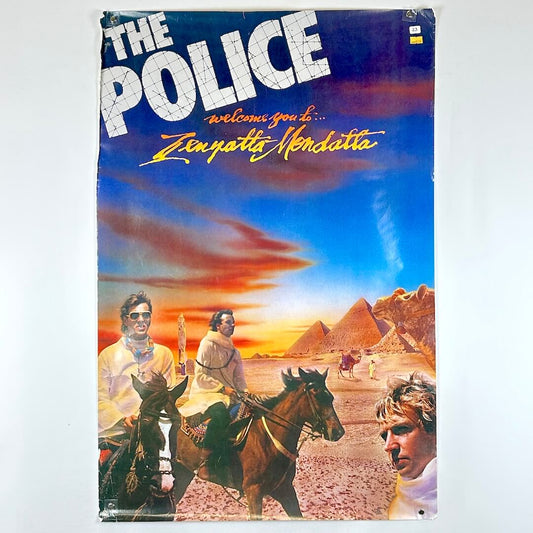 Album cover for 'Zenyatta Mondatta' by The Police with desert scene and people on horses.