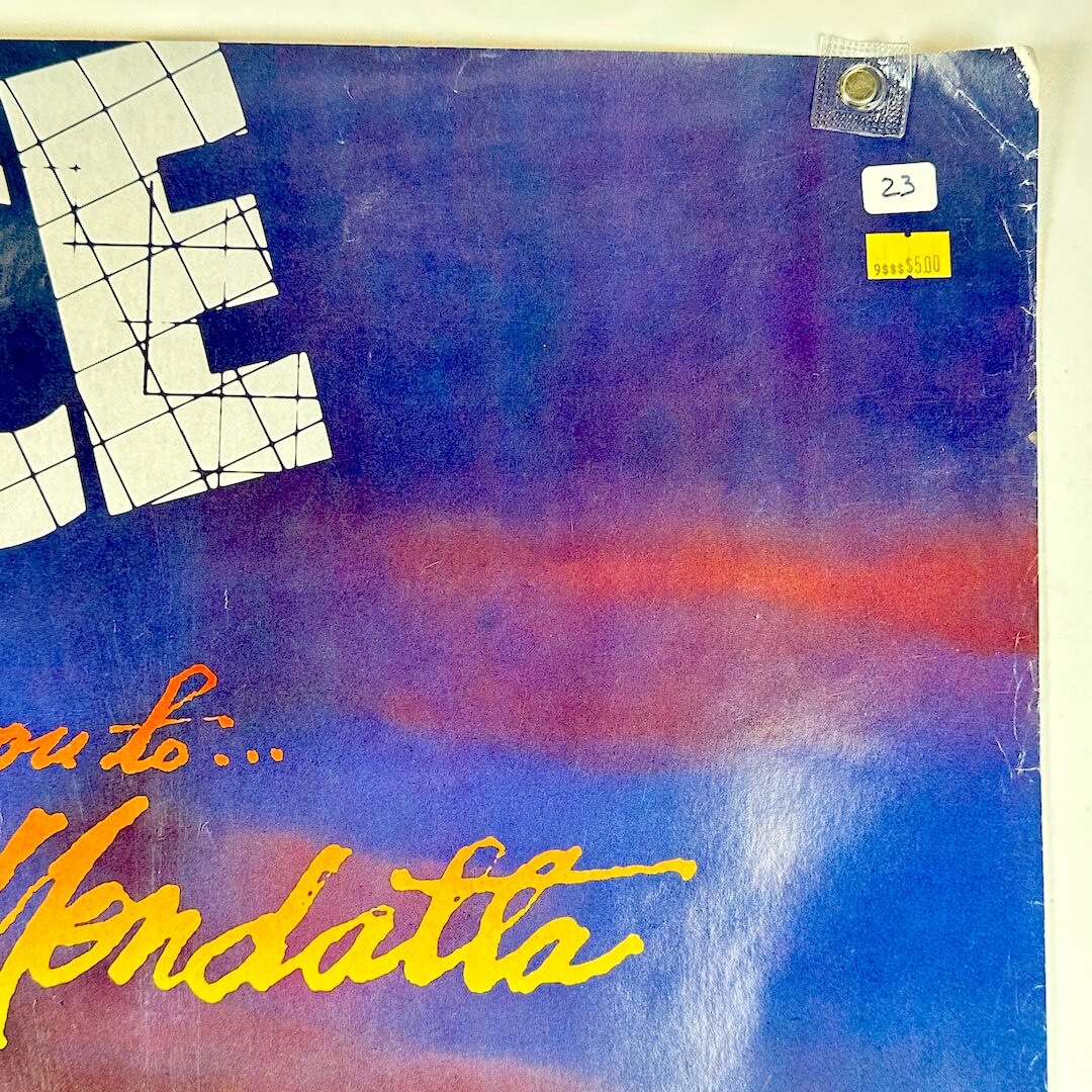 Top right corner of poster with old price tags and edge wear to long edge and corner. 