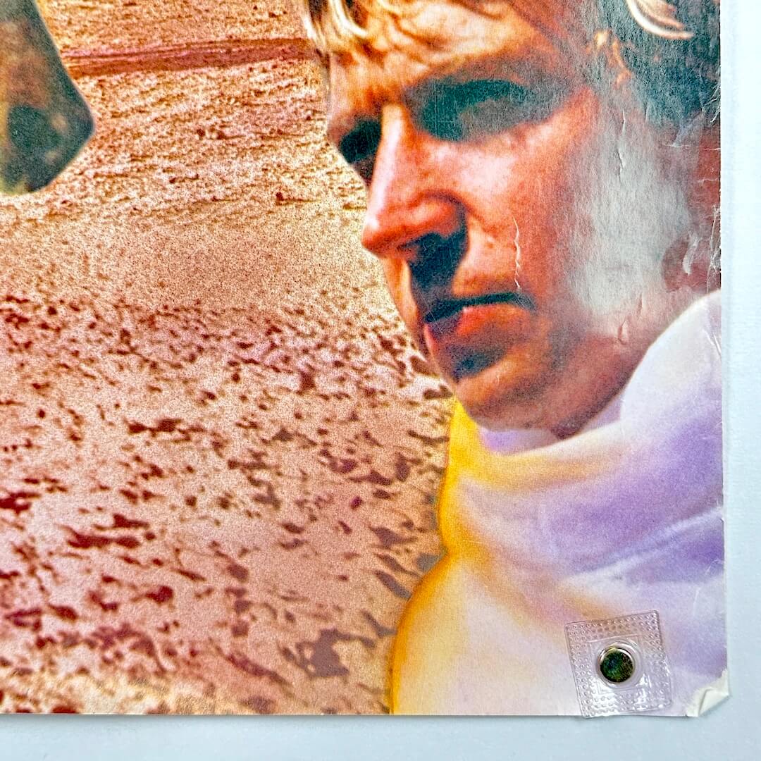 Bottom right corner of poster with rolled/creased corner and wear along long edge. 