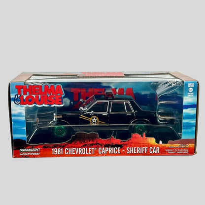 A boxed die-cast model car of a 1981 Chevrolet Caprice as a sheriff car from the movie 'Thelma & Louise'. 