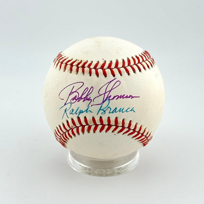 Baseball with autographs on a white background
