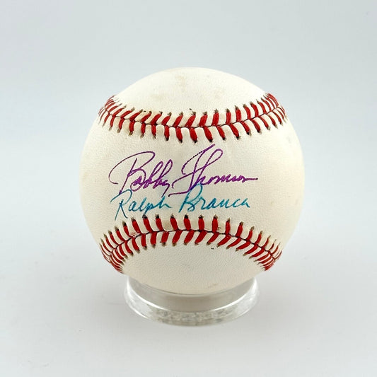 Baseball with autographs on a white background
