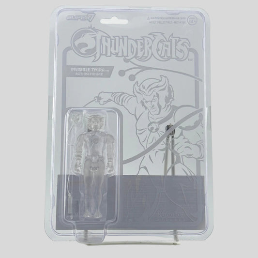 Front of clear package with illustration of character on backing, action figure in clear blister at left, comes with one accessories. 