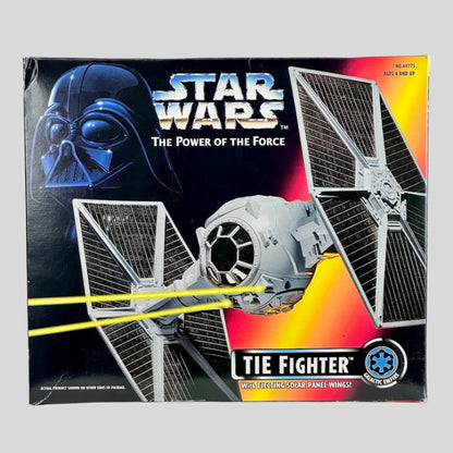 Star Wars TIE Fighter toy packaging with Darth Vader helmet and Tie Fighter on a black background.