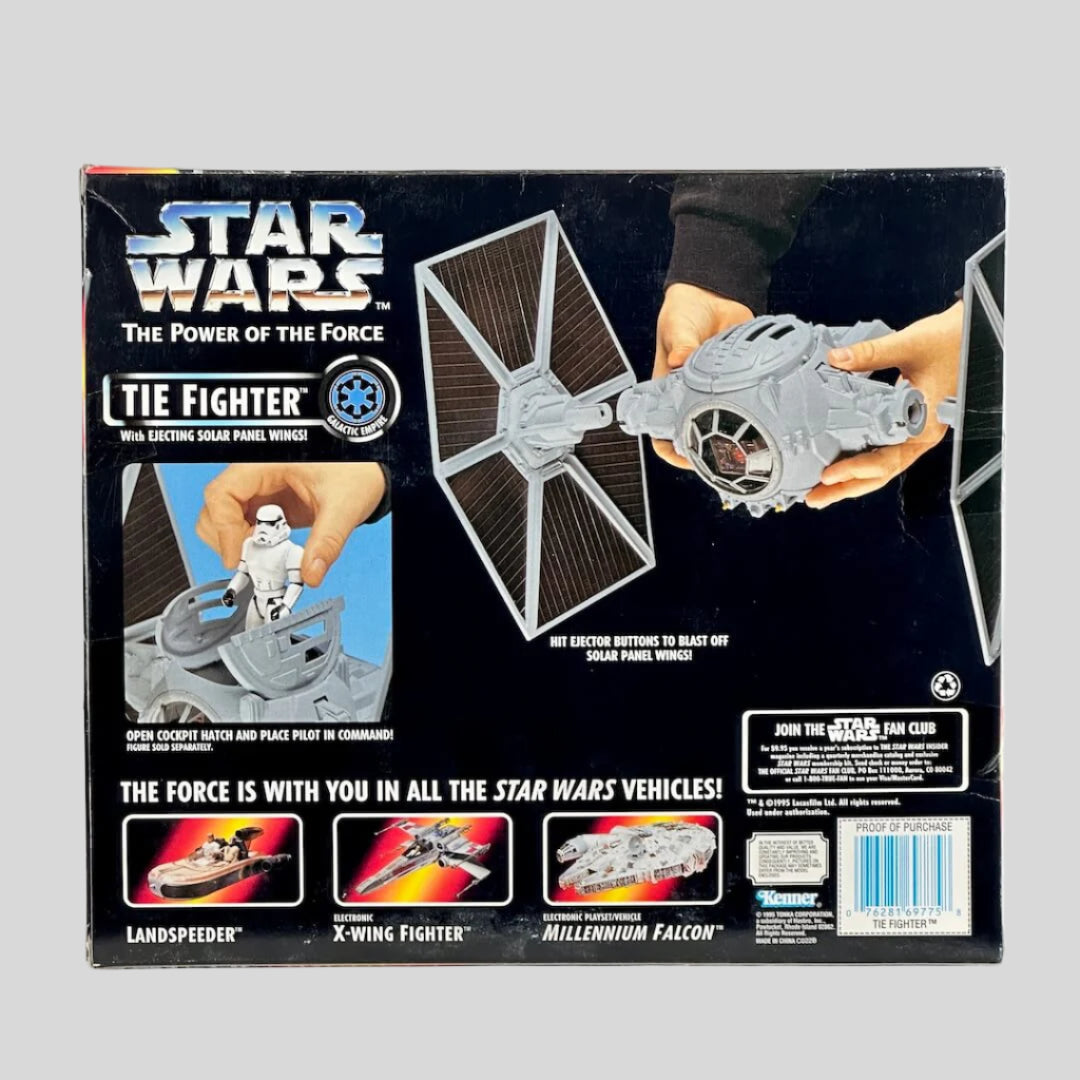 Star Wars TIE Fighter toy packaging with hands holding the toy on a white background