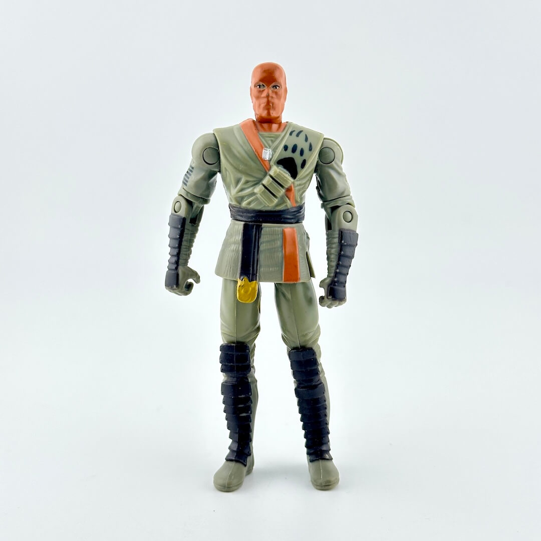 Action figure of an orange hooded man wearing a gray and black martial arts outfit with orange accents.