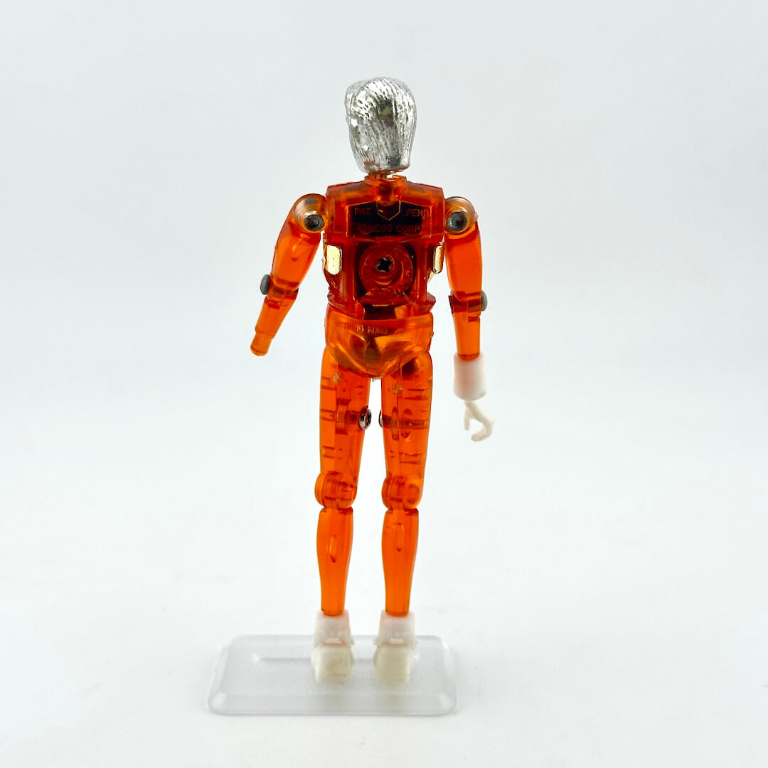 Translucent Orange and silver humanoid action figure standing on white background. 