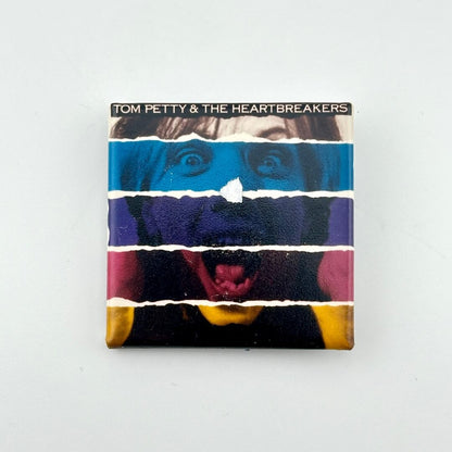 Pin of album cover for Tom Petty & The Heartbreakers on a white background