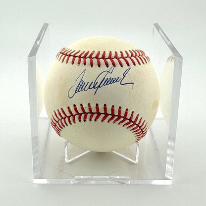 Signed baseball in clear display against white background.