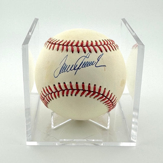 Signed baseball in clear display against white background.
