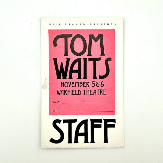 Vintage laminate card with white border, pink square in center with event details in black text. "STAFF" print at bottom. 