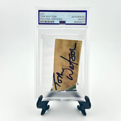 Autographed piece of paper with a clear display case and certification label on a white background