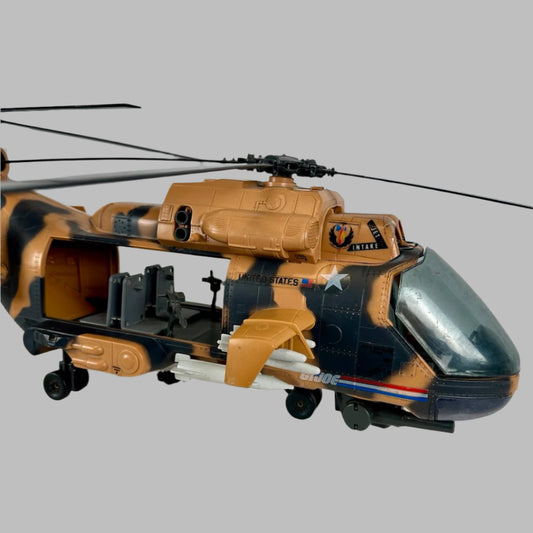 Image of plastic camel brown with black camouflage spots helicopter, white missiles under the wing, gray guns & seats inside.