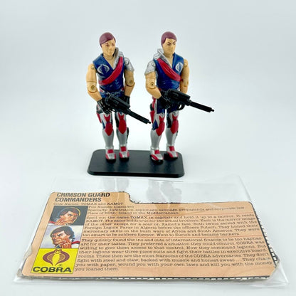 Two toy figures in military uniforms with a Cobra branded card on a white background