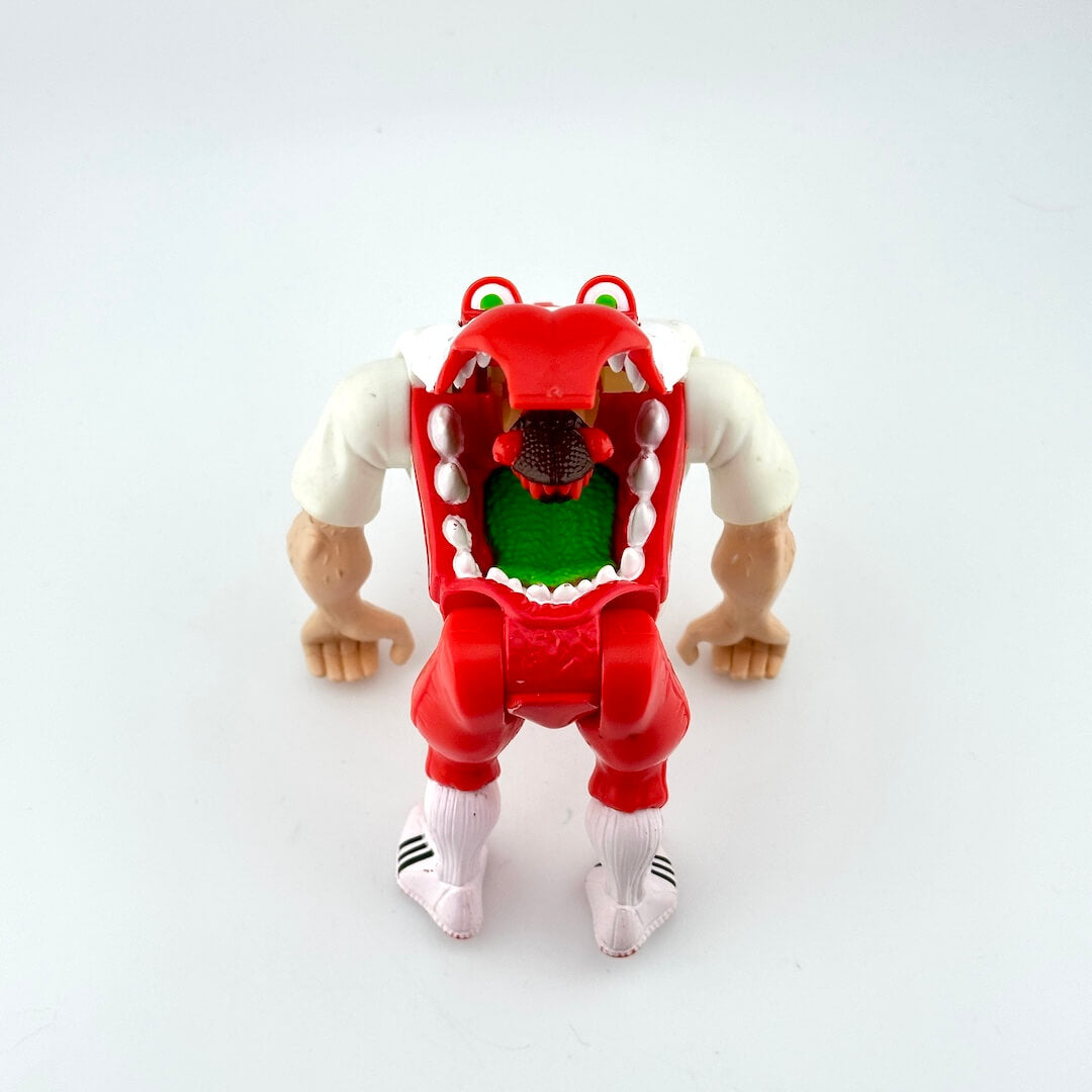 Toy figure with a red and white design on a light gray background