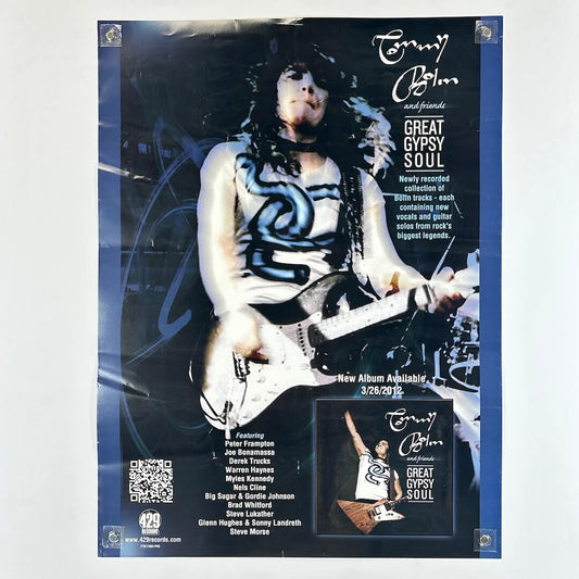 Poster with image of man playing guitar in center, text throughout describing upcoming album release, with mini album artwork in corner. 