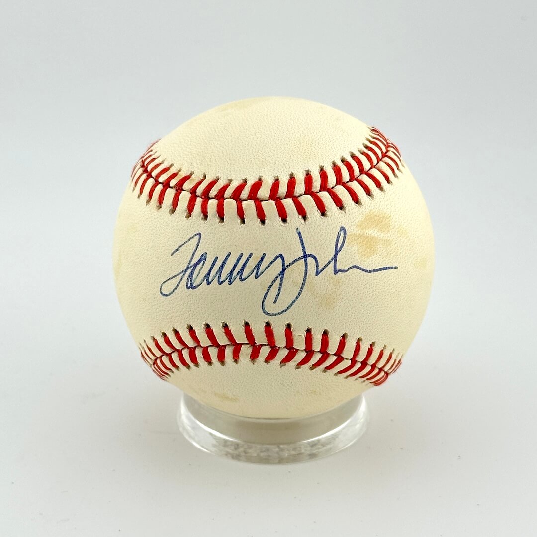 Baseball with a signature on a white background