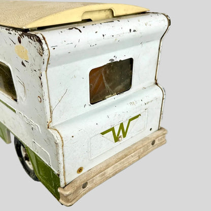 Vintage toy truck with a white body and green base on a white background