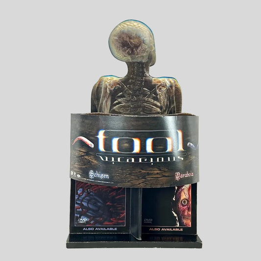 Retail display stand for TOOL "Vicarious" single and two other albums on light background. 