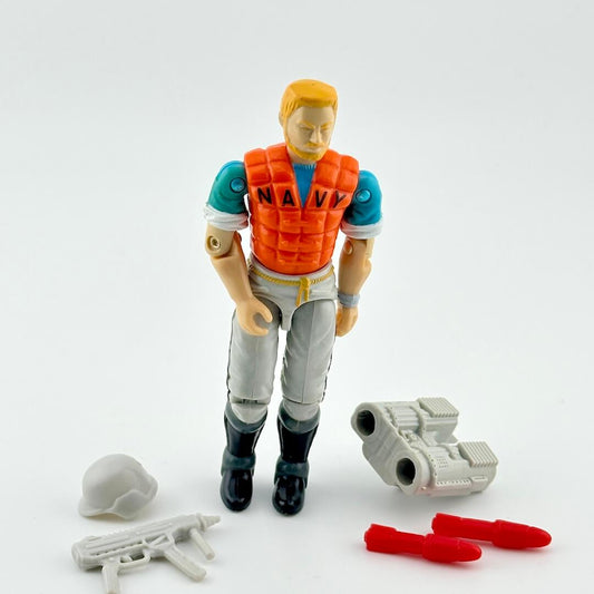 Toy figure in navy gear with accessories on a white background