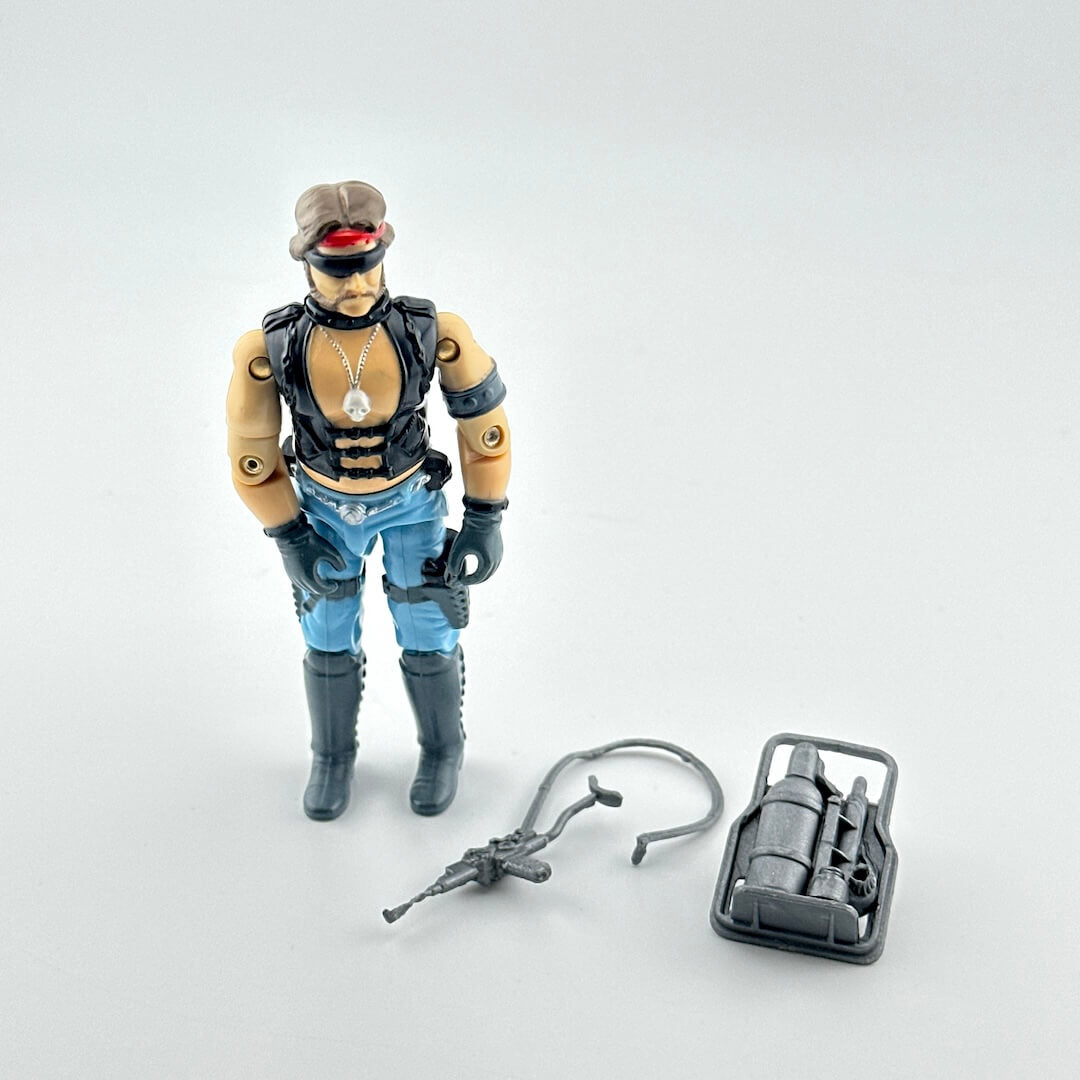 Toy figure with accessories on a light gray background