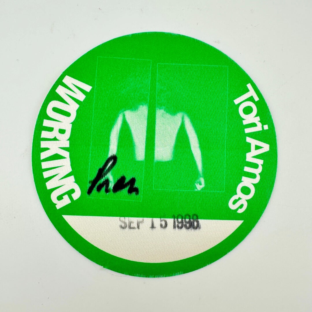 Green circular sticker with 'Working' text and a signature, on a white background