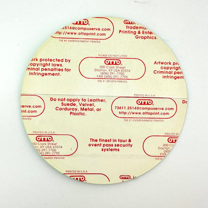 Round label with red text on a white background