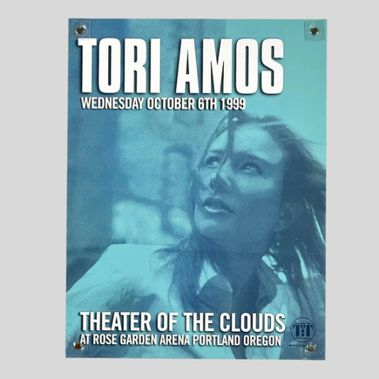 Blue monochromatic poster picturing Tori Amos looking up & left, white text for event & venue information. 