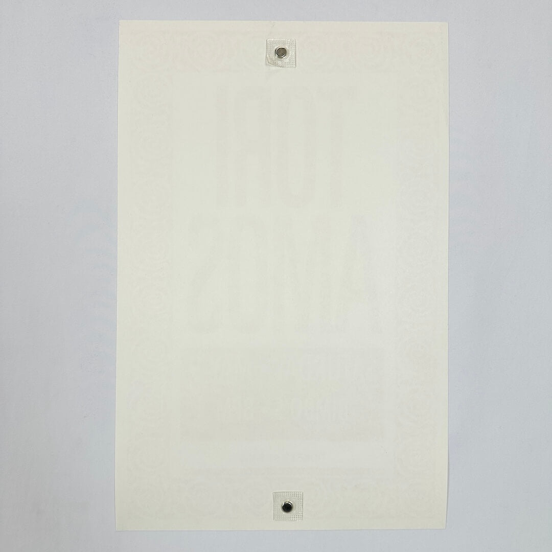 Backside of white poster showing zero damage against white background. 