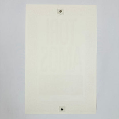 Backside of white poster showing zero damage against white background. 