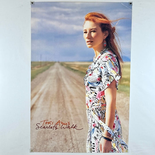 Poster of a woman in a patterned dress standing on a dirt road with 'Tori Amos Scarlet's Walk' text.