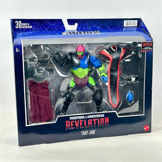 Masters of the Universe Revelation Trap Jaw action figure in its original retail packaging, featuring a blue and black box.