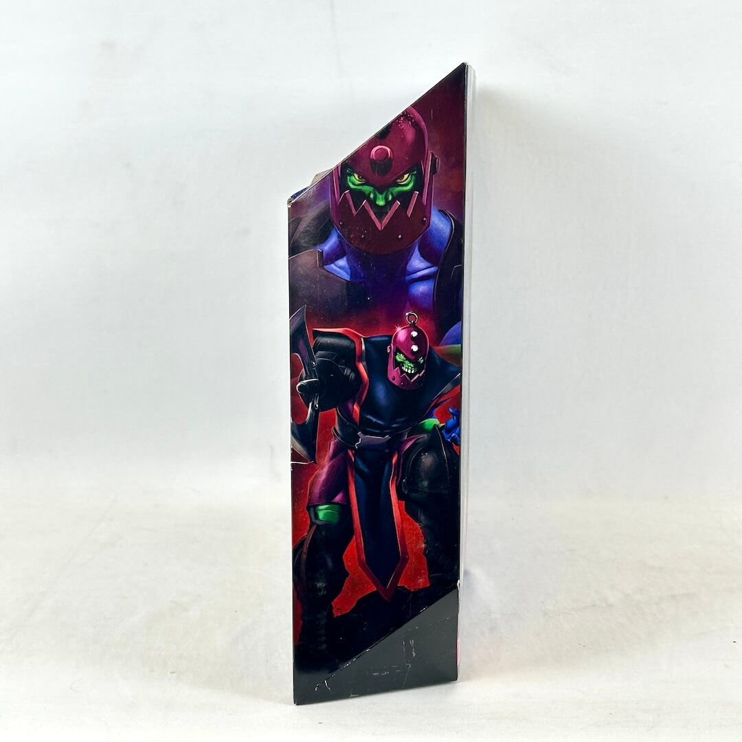 Side view of packaging with illustration of Trap Jaw in action, photographed on light background. 