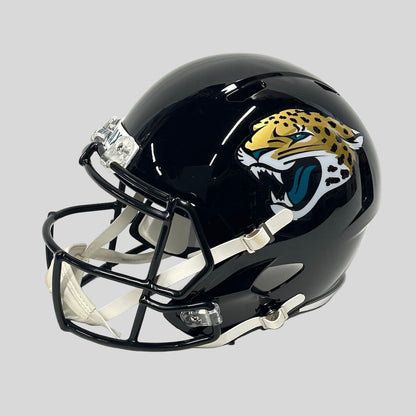 Black football helmet with a jaguar logo on a white background