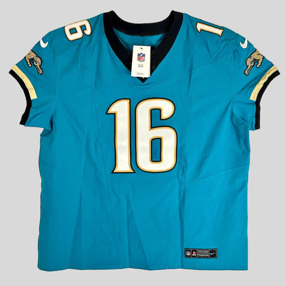 A Nike Jacksonville Jaguars #16 football jersey in teal blue, laid flat on a white background. 