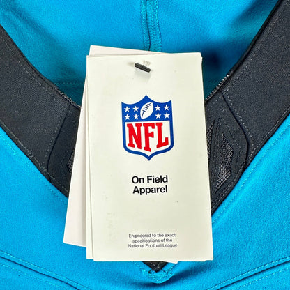 A blue sports jersey with a black V-neck collar and a white NFL hangtag reading 'On Field Apparel' with the NFL shield logo.