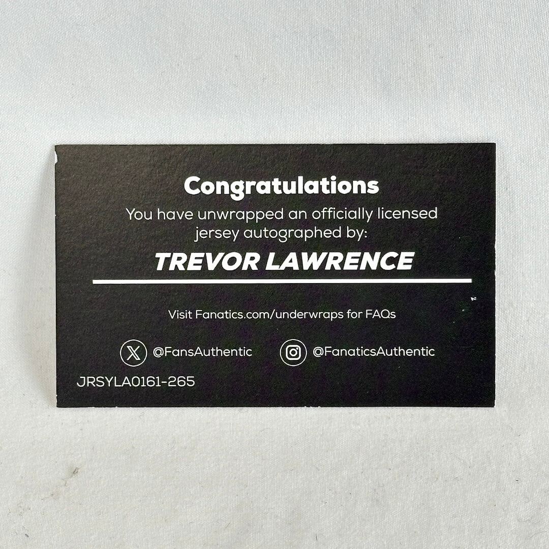 A black rectangular autograph card with white text celebrating a Trevor Lawrence jersey autograph.
