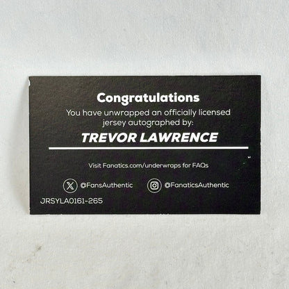 A black rectangular autograph card with white text celebrating a Trevor Lawrence jersey autograph.