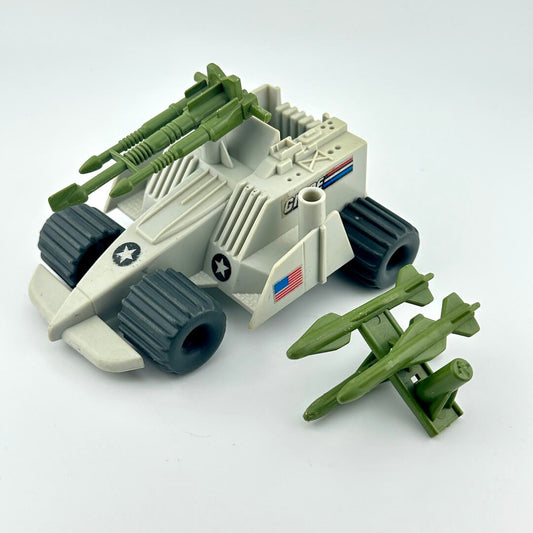 Toy military vehicle with green missiles on a white background
