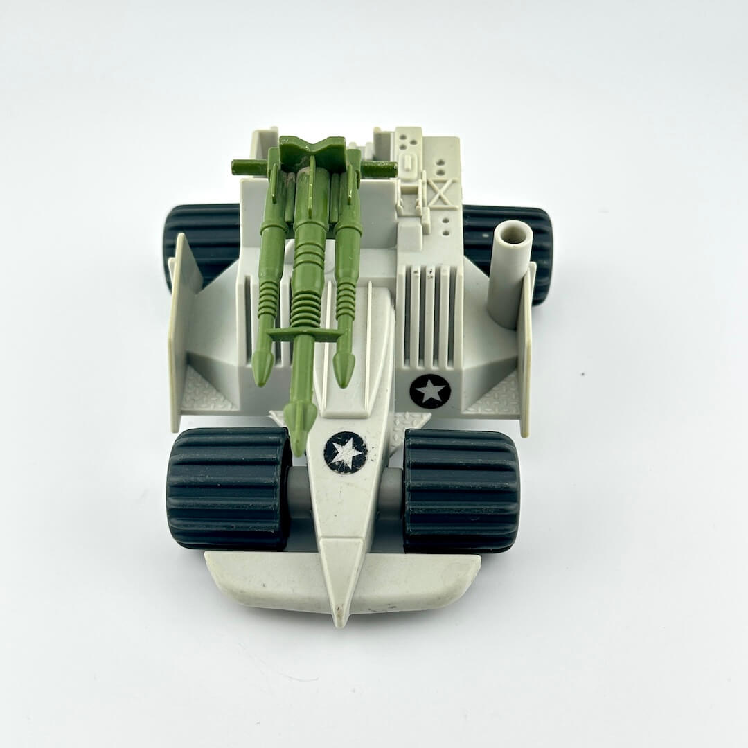 Toy military vehicle with green missiles on a white background