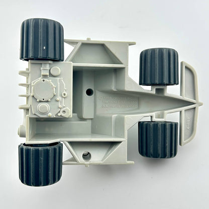 Toy military vehicle with green missiles on a white background