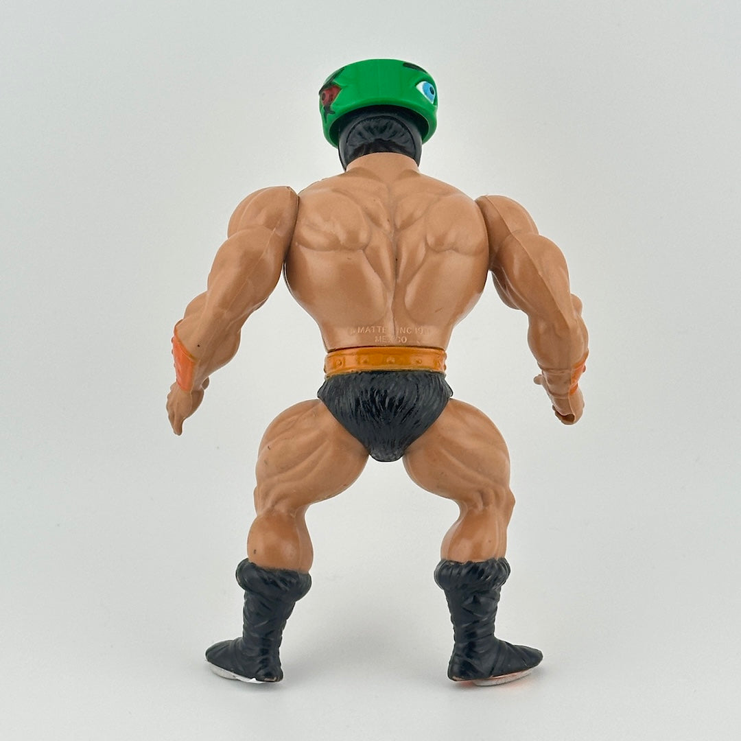 White male action figure with green visor that turns to show different eyes wearing black loincloth & boots, belt & gauntlets