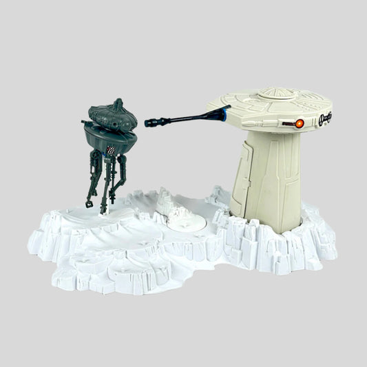 Toy set with a turret tower and a robot on a white background