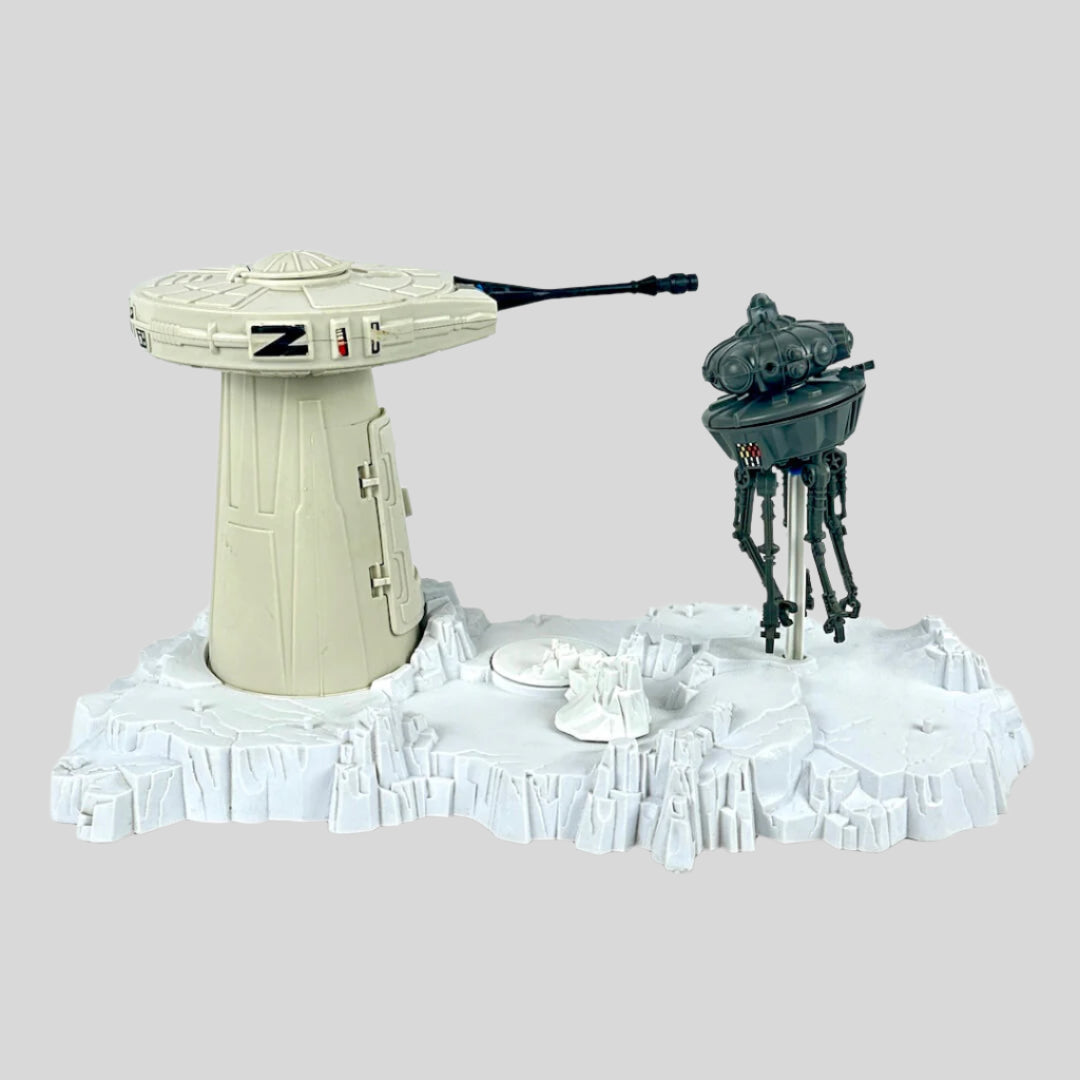 Toy set with a turret tower and a robot on a white background