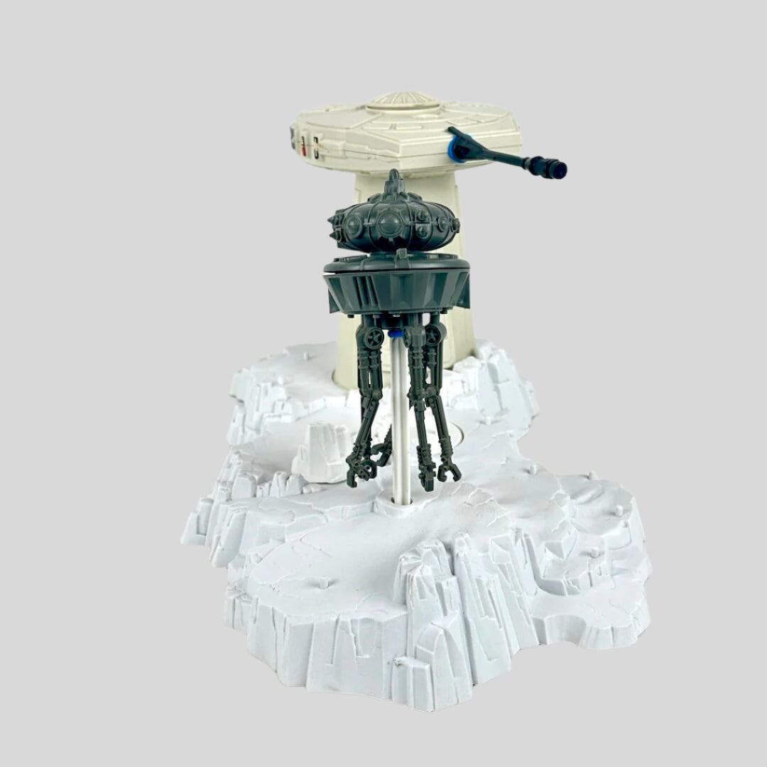 Toy set with a turret tower and a robot on a white background