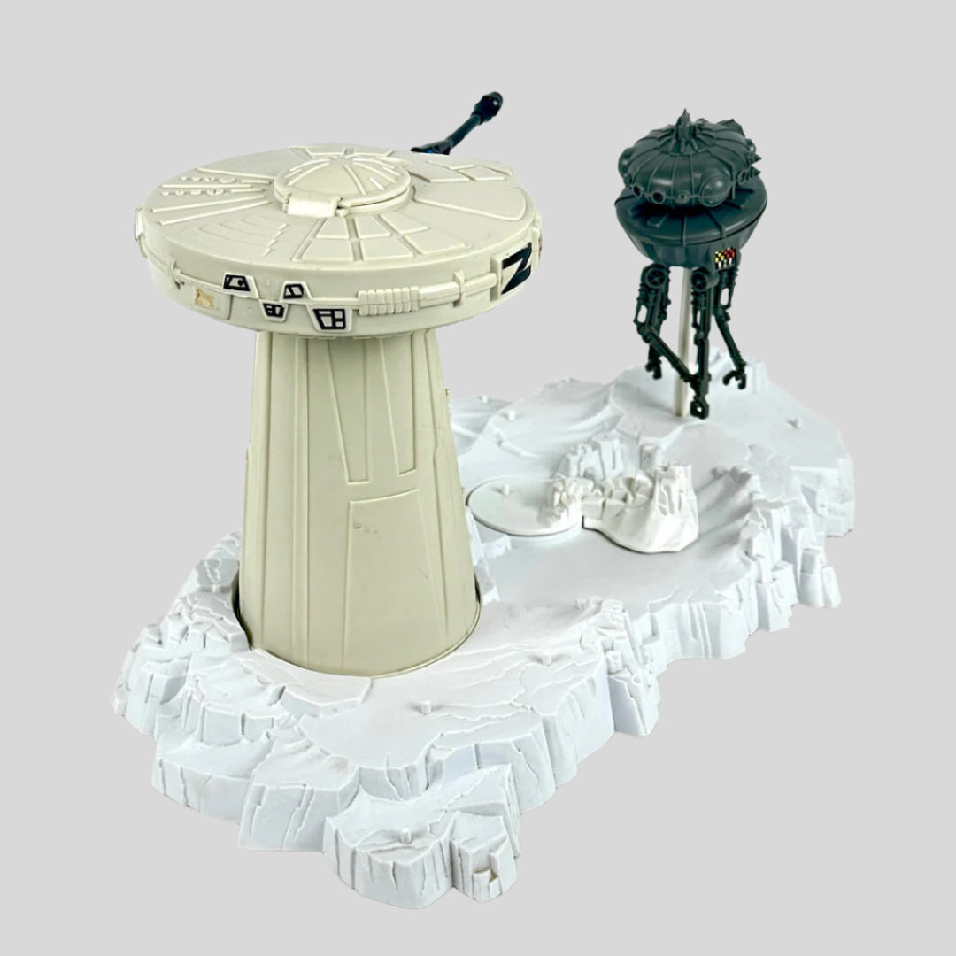 Toy set with a turret tower and a robot on a white background