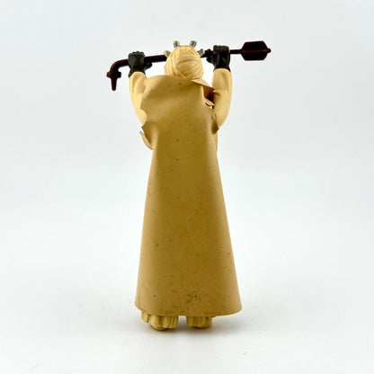 Figure in a long beige robe holding staff on a white background