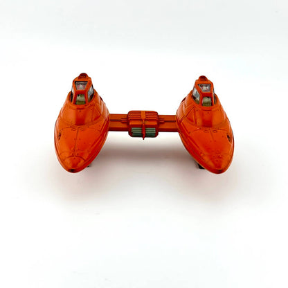 Orange toy spaceship on a white background