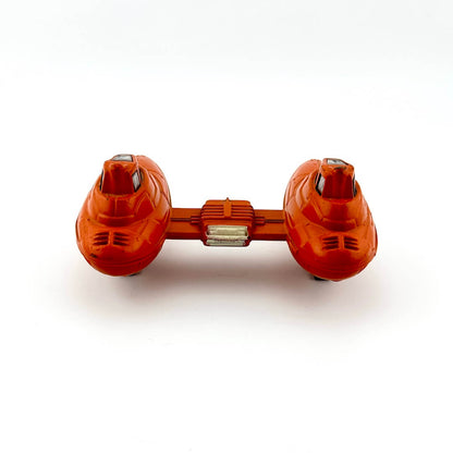 Orange dumbbell-shaped spaceship on a white background