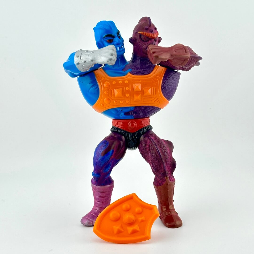 Double headed action figure with blue, purple, and orange colors on a white background